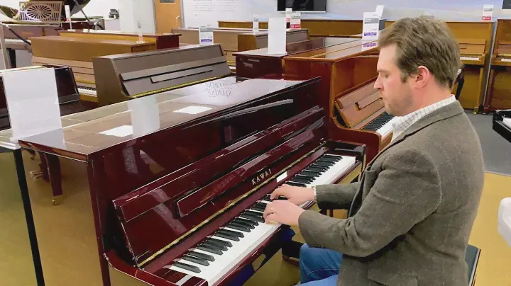Kawai K-200 upright piano in polished mahogany c.2014